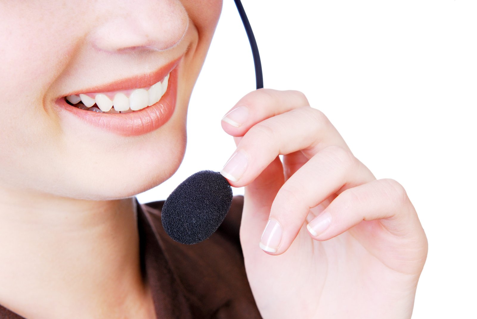 Young woman speaking by headphones. Close-up human mouth.